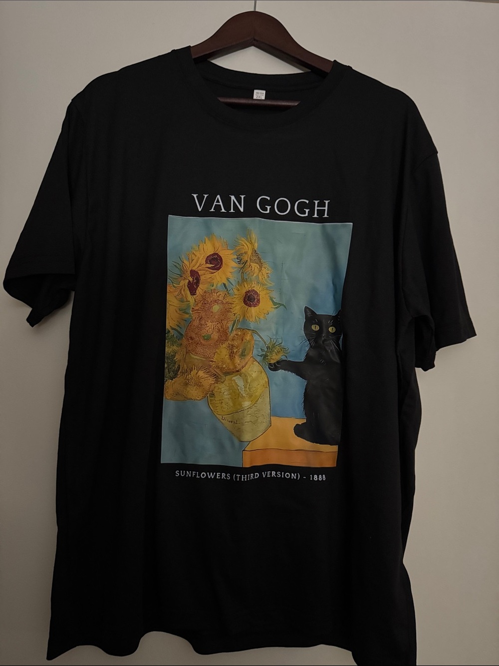Black Graphic Tee with Sunflowers and Cat Artwork